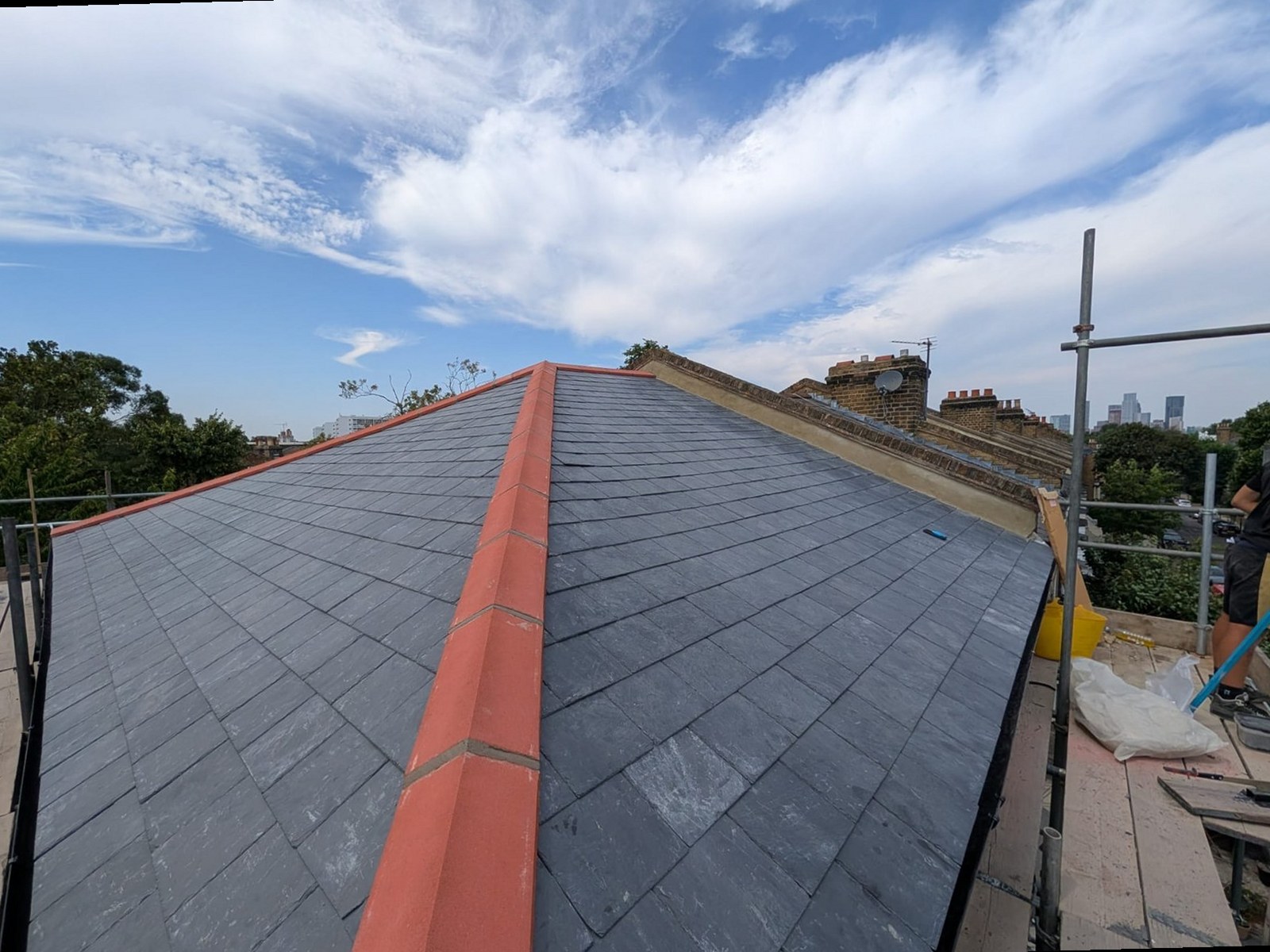 New pitched slate roof with red ridge tiles completed by Harding & Co.