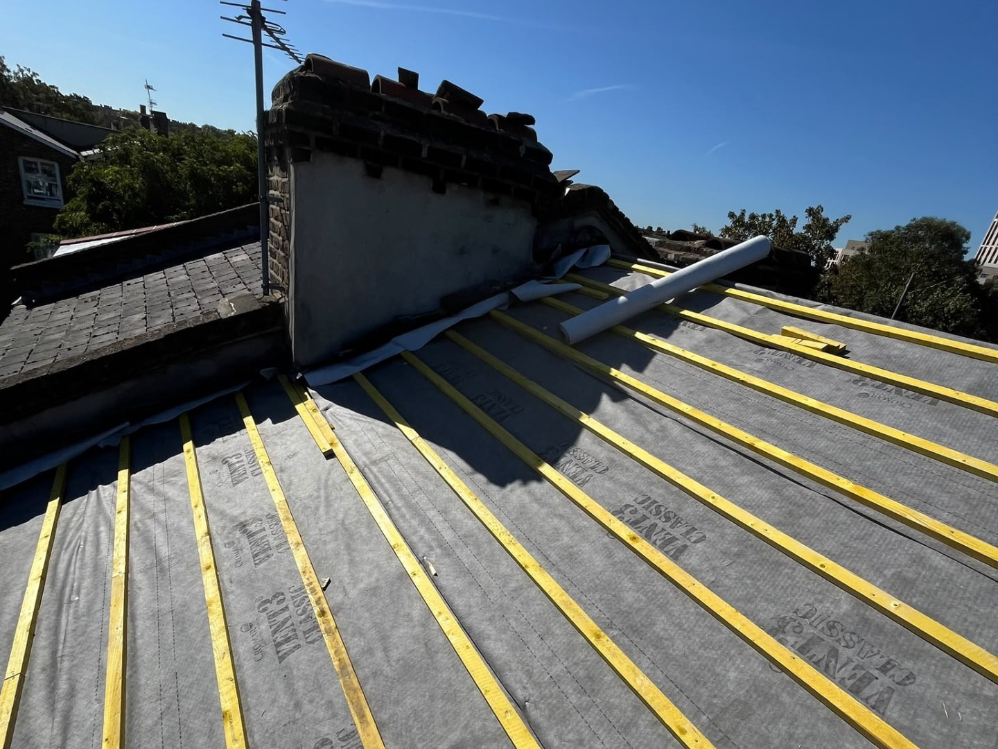 Roof stripped back to bare rafters, membrane and battens during a re-roof