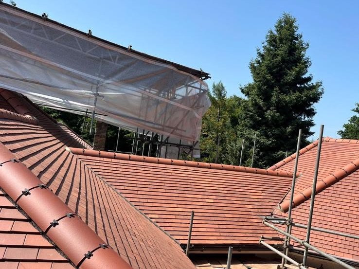 Storm-exposed tiled roof made safe under scaffolding by the Harding & Co. team